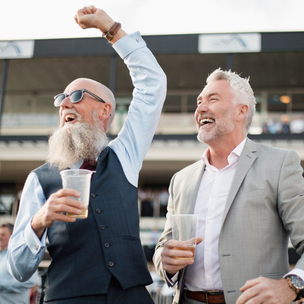 two men enjoying a day at the races