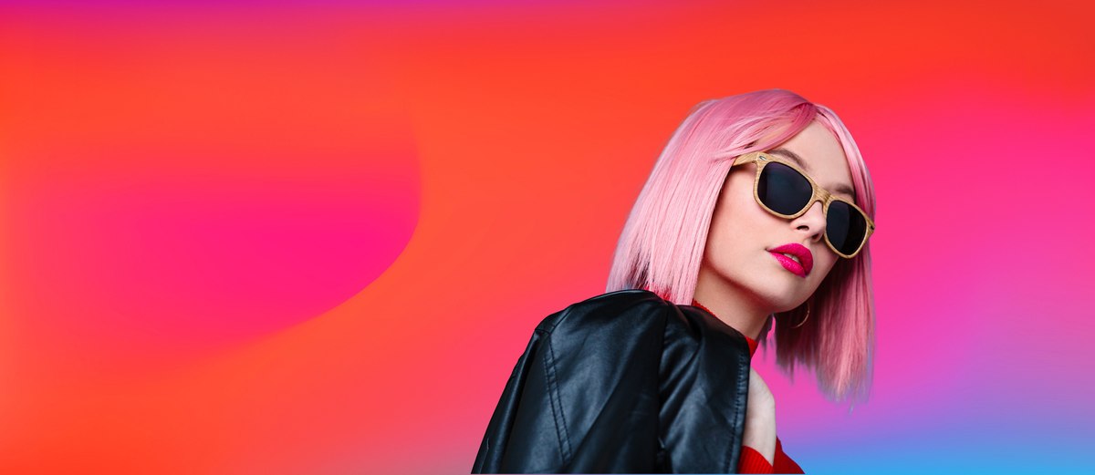 woman with pink hair and sunglasses
